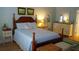 Comfortable bedroom featuring a wooden four poster bed and matching side tables and dresser at 1757 Wayah Dr, Charleston, SC 29414