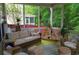 Inviting screened porch featuring comfortable seating and a view of the lush green outdoors at 1757 Wayah Dr, Charleston, SC 29414