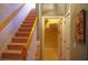 Traditional staircase with carpeted steps leading to an upper level and an open doorway at 1757 Wayah Dr, Charleston, SC 29414