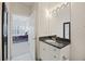 Bathroom featuring granite countertop and access to the bedroom at 1984 Folly Rd # A307, Charleston, SC 29412