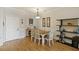 Dining area with seating for six, complemented by modern decor and bright natural light at 1984 Folly Rd # A307, Charleston, SC 29412
