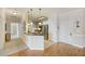Cozy home entrance leading into an open-concept living space with bright lighting and hardwood floors at 1984 Folly Rd # A307, Charleston, SC 29412