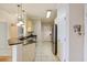 Well-lit kitchen featuring modern appliances, granite counters and tile flooring at 1984 Folly Rd # A307, Charleston, SC 29412