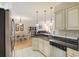 An open kitchen and dining area featuring granite counters, stainless steel appliances, and neutral cabinetry at 1984 Folly Rd # A307, Charleston, SC 29412