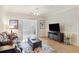 Cozy living room showcasing hardwood floors, a ceiling fan, and bright natural light at 1984 Folly Rd # A307, Charleston, SC 29412