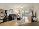 Comfortable living room with a gray sofa and a view into a sunroom featuring lots of natural light at 1984 Folly Rd # A307, Charleston, SC 29412