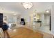Open-concept living space featuring a ceiling fan and seamless flow to dining and kitchen areas at 1984 Folly Rd # A307, Charleston, SC 29412