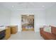 Multi-purpose room with views to the living areas, tile floors, and a ceiling fan at 1984 Folly Rd # A307, Charleston, SC 29412