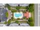 Aerial view of community pool with lounge chairs and a pergola surrounded by landscaped paths and parking at 1984 Folly Rd # A307, Charleston, SC 29412