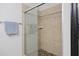 Updated shower featuring decorative tile, glass door and pebble floor at 1984 Folly Rd # A307, Charleston, SC 29412