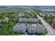 Aerial view of condo community with marsh views, roads, and landscaped grounds at 1984 Folly Rd # B114, Charleston, SC 29412