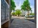 Apartment building with parking and landscaping viewed from the sidewalk and mailbox area at 1984 Folly Rd # B114, Charleston, SC 29412