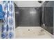 Bathroom includes a jetted bathtub and shower with blue patterned curtain at 1984 Folly Rd # B114, Charleston, SC 29412