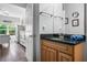 Bathroom features a granite countertop and wood vanity with a view into the main bedroom at 1984 Folly Rd # B114, Charleston, SC 29412