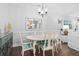 Dining room with seating for six, wood floors, and stylish decor and artwork at 1984 Folly Rd # B114, Charleston, SC 29412
