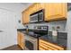 Modern kitchen features stainless steel appliances and granite countertops at 1984 Folly Rd # B114, Charleston, SC 29412