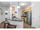 Well-lit kitchen features stainless steel appliances, a breakfast bar, and hardwood flooring at 1984 Folly Rd # B114, Charleston, SC 29412