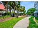 The community features well-maintained sidewalks surrounded by palm trees and lush green spaces at 1984 Folly Rd # B114, Charleston, SC 29412