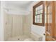 Functional bathroom with a walk-in shower, toilet, and window providing natural light and ventilation at 204 Knightsbridge, Charleston, SC 29418