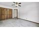 Bedroom featuring a double-door closet, neutral carpet, ceiling fan, and an adjacent room at 204 Knightsbridge, Charleston, SC 29418