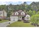 Charming two-story home featuring a well-manicured lawn and a two-car garage at 204 Knightsbridge, Charleston, SC 29418