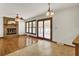 Living area with hardwood floors, brick fireplace, and sliding doors to a sunroom at 204 Knightsbridge, Charleston, SC 29418