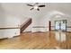 Spacious living room with gleaming hardwood floors and staircase, filled with natural light at 204 Knightsbridge, Charleston, SC 29418