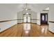 Bright living room featuring beautiful hardwood floors and an arched window at 204 Knightsbridge, Charleston, SC 29418