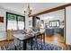 Dining room with wooden table and chairs, stylish chandelier, and lots of natural light at 205 Tea Farm Rd, Summerville, SC 29483
