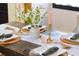 Close-up of dining table decorated with candle holders, vases, beaded garland and cloth napkins at 205 Tea Farm Rd, Summerville, SC 29483