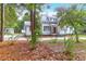 Picturesque home nestled among trees, with charming details and a well-maintained yard at 205 Tea Farm Rd, Summerville, SC 29483