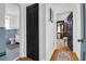 Hallway showing access to a blue tiled bathroom and an office area with hardwood floors at 205 Tea Farm Rd, Summerville, SC 29483