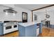 This kitchen features an island with an oven and an open entryway into the dining room at 205 Tea Farm Rd, Summerville, SC 29483