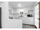 Cozy kitchen featuring white cabinets, stainless steel appliances, and ample counter space at 205 Tea Farm Rd, Summerville, SC 29483