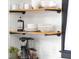 Open kitchen shelves with dishes, mugs, and coffee appliances at 205 Tea Farm Rd, Summerville, SC 29483