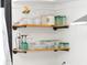 Open kitchen shelves with glasses, pitchers, and decorative items at 205 Tea Farm Rd, Summerville, SC 29483