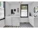 The laundry room features tile floors, a sink and a large window at 205 Tea Farm Rd, Summerville, SC 29483