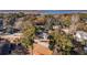 A bird's-eye view of a home nestled among lush trees, with a glimpse of a river in the distance at 2178 Fort Pemberton Dr, Charleston, SC 29412
