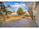 Large wooden deck surrounded by trees and greenery, offering ample space for outdoor entertaining at 2178 Fort Pemberton Dr, Charleston, SC 29412