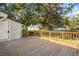 Wooden deck with a view of the backyard, surrounded by mature trees, and lush greenery at 2178 Fort Pemberton Dr, Charleston, SC 29412