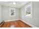 Bedroom featuring hardwood floors, two windows, ceiling fan, and light gray walls at 2178 Fort Pemberton Dr, Charleston, SC 29412