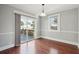 Dining room area featuring hardwood floors, a sliding glass door leading to the deck, and a pendant light at 2178 Fort Pemberton Dr, Charleston, SC 29412