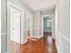 Hallway has hardwood floors, light gray walls, and white trim leading to other rooms at 2178 Fort Pemberton Dr, Charleston, SC 29412