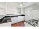 Kitchen with white cabinets, granite countertops, stainless steel appliances, and a farmhouse sink at 2178 Fort Pemberton Dr, Charleston, SC 29412