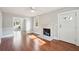 Bright living room featuring a fireplace, hardwood floors, ceiling fan, and access to a deck at 2178 Fort Pemberton Dr, Charleston, SC 29412