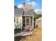 Inviting screened porch entry with a brick staircase leading to the charming exterior at 2178 Fort Pemberton Dr, Charleston, SC 29412