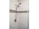Close up of shower features tiled wall and mosaic decorative stripe at 2178 Fort Pemberton Dr, Charleston, SC 29412