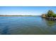 Serene water view of the river with a boat speeding through on a clear day at 2178 Fort Pemberton Dr, Charleston, SC 29412