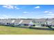Community aerial view featuring green spaces, fenced yards, and single-Gathering homes on a bright day at 221 Seaworthy St, Summerville, SC 29486