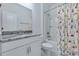 Clean bathroom with granite countertop, white cabinets, and a shower-tub combo at 221 Seaworthy St, Summerville, SC 29486